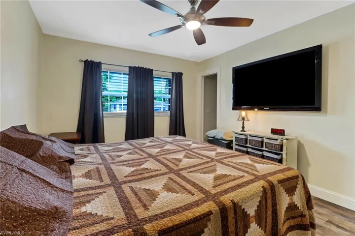 Bedroom with light wood-type flooring and ceiling fan