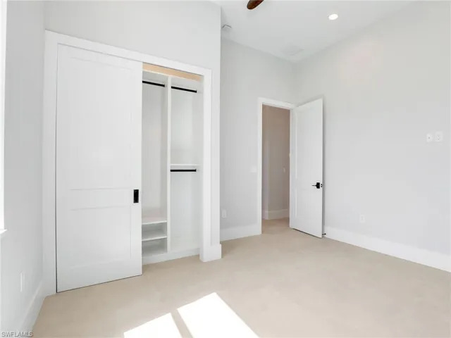 Unfurnished bedroom featuring a ceiling fan, recessed lighting, a closet, and baseboards