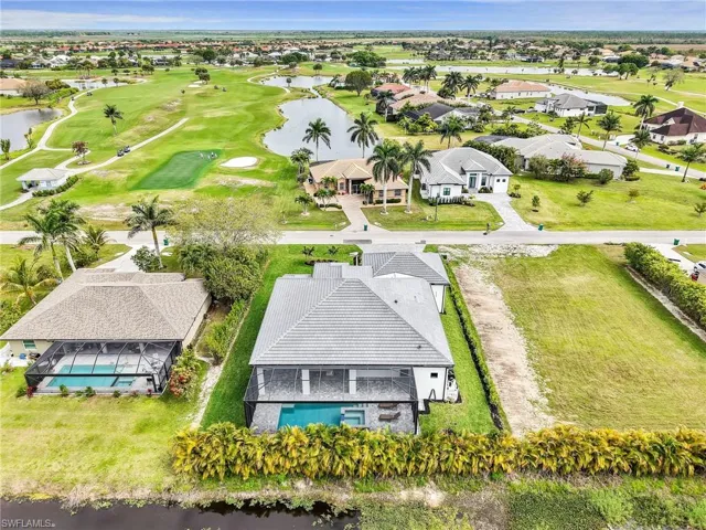 Bird's eye view featuring view of golf course, a water view, and a residential view