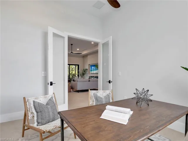 Office with a ceiling fan, recessed lighting, and visible vents