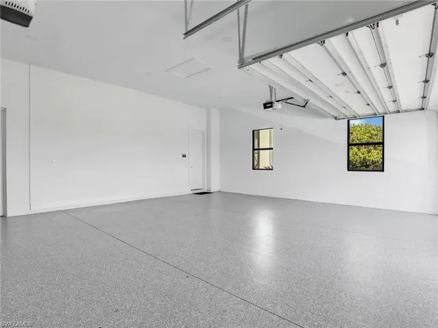 Garage featuring a garage door opener