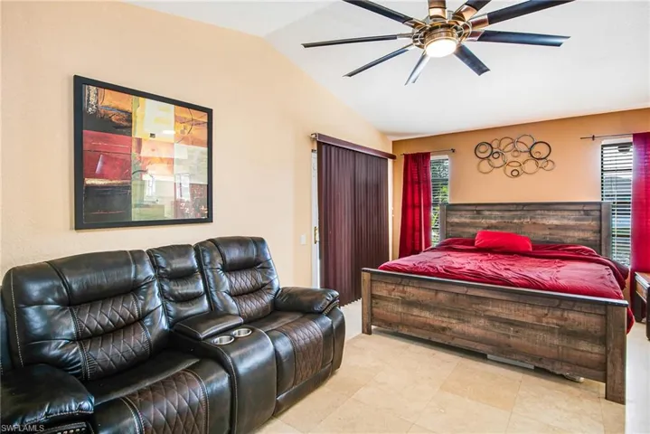 Bedroom featuring lofted ceiling and a ceiling fan