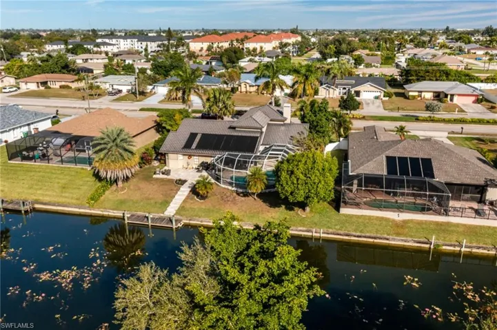 Aerial view of residential area with a nearby body of water