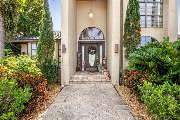 Property entrance with stucco siding