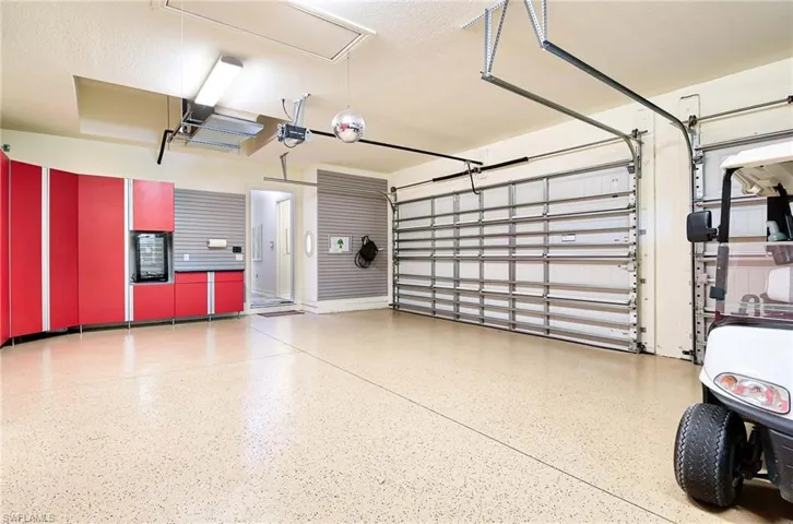 3 car garage with plenty of professional storage units