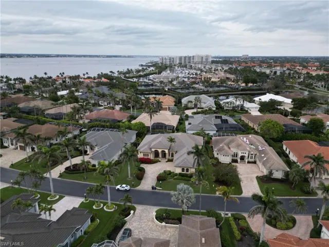 Drone / aerial view with a water view and a residential view