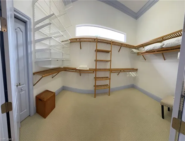 Walk in closet featuring carpet flooring