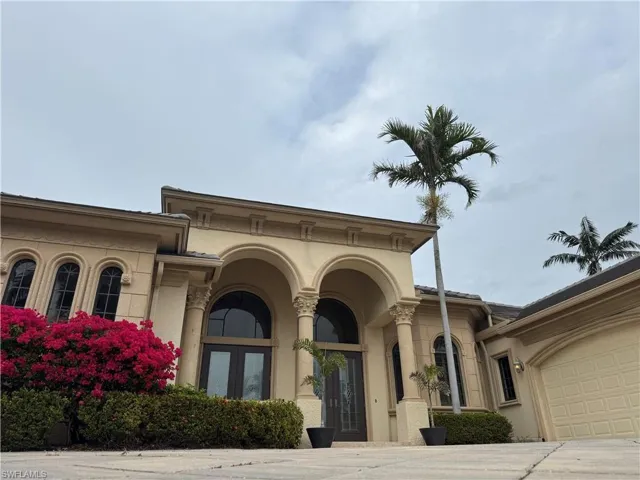 View of building exterior with a garage
