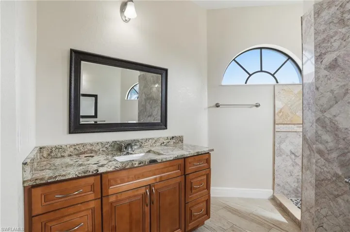 Primary Bathroom featuring vanity and a walk in shower