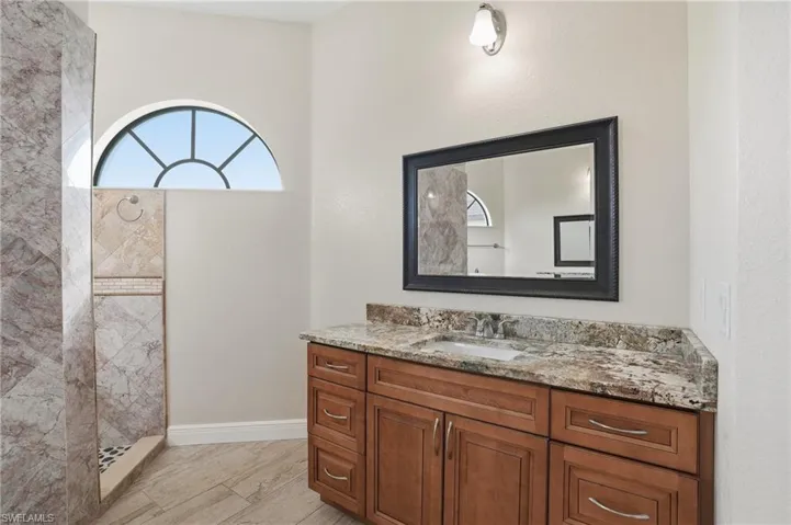 Primary bathroom featuring vanity and walk in shower