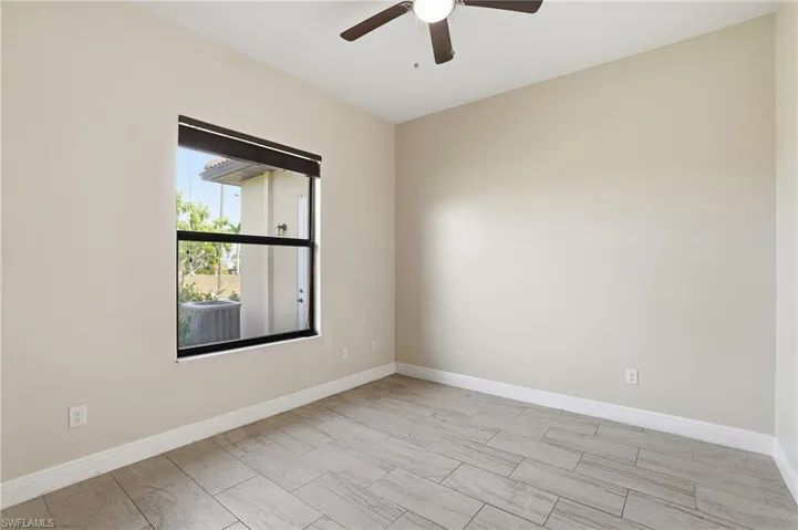Bedroom with baseboards and ceiling fan
