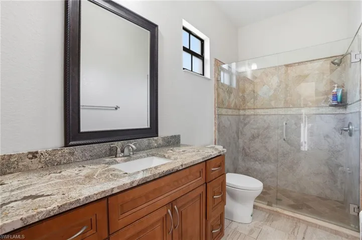 Pool Bathroom with vanity and a stall shower