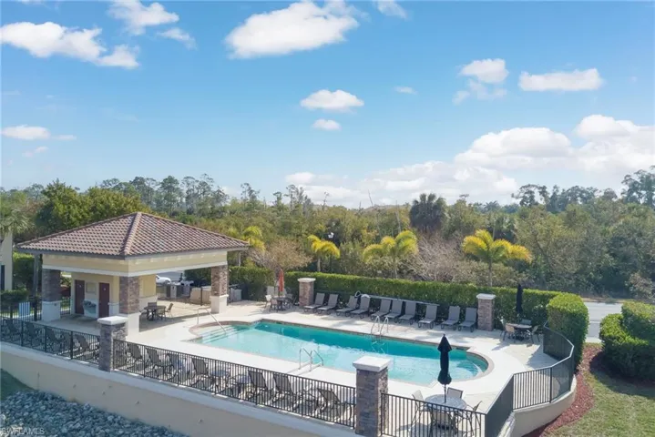 Community pool featuring a patio area