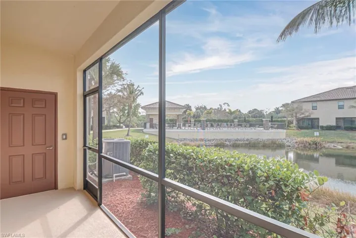 Unfurnished sunroom featuring a water view