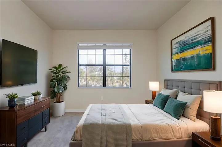 Carpeted bedroom with baseboards