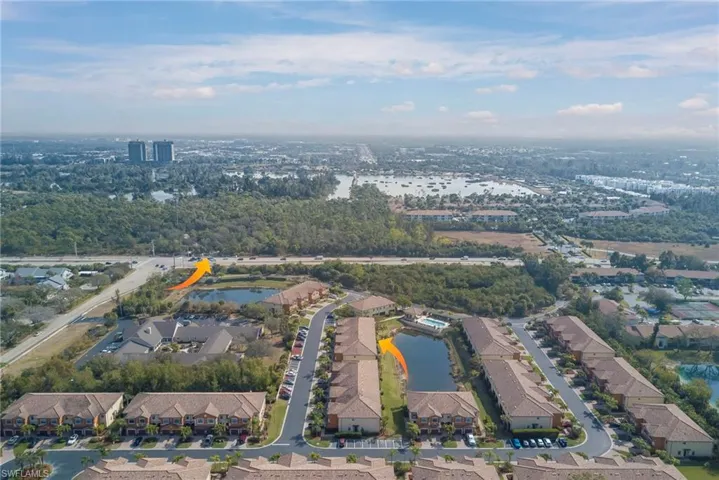 Aerial view of residential area with a nearby body of water