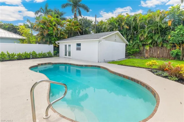 View of pool with a patio and a fenced backyard