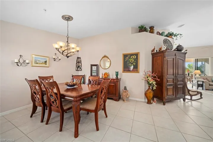Dining room featuring a chandelier and light tile patterned floors