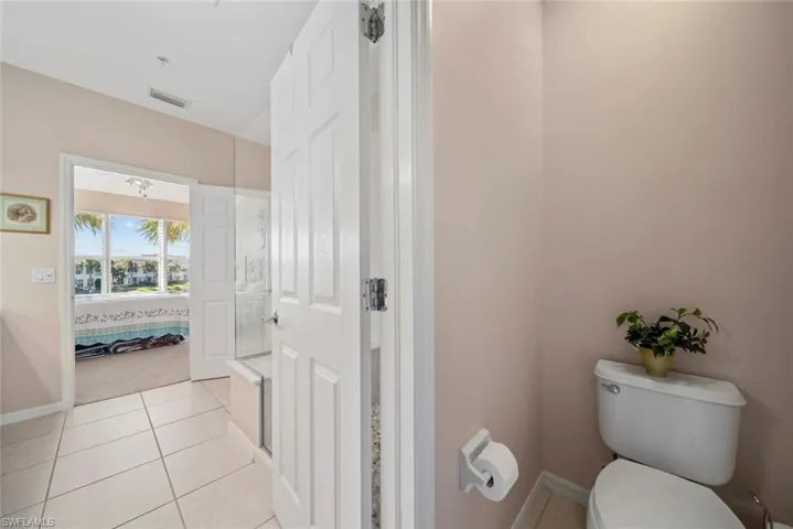 Bathroom featuring tile patterned floors and toilet