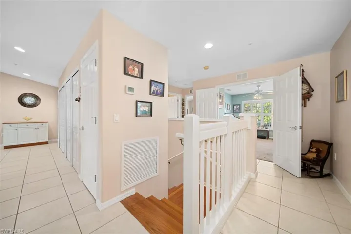 Hallway with light tile patterned floors