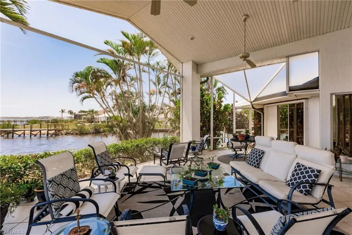 View of patio / terrace featuring an outdoor hangout area, a water view, and ceiling fan