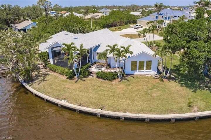 View from above of property with a nearby body of water