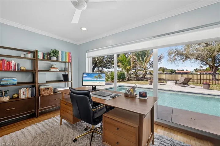 Office area featuring ceiling fan, ornamental molding, wood finished floors, and recessed lighting