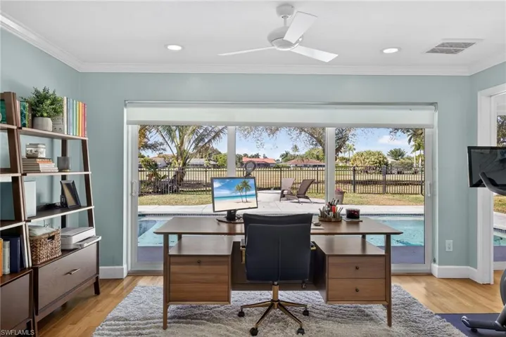 Office with ornamental molding, a ceiling fan, light wood-type flooring, and recessed lighting