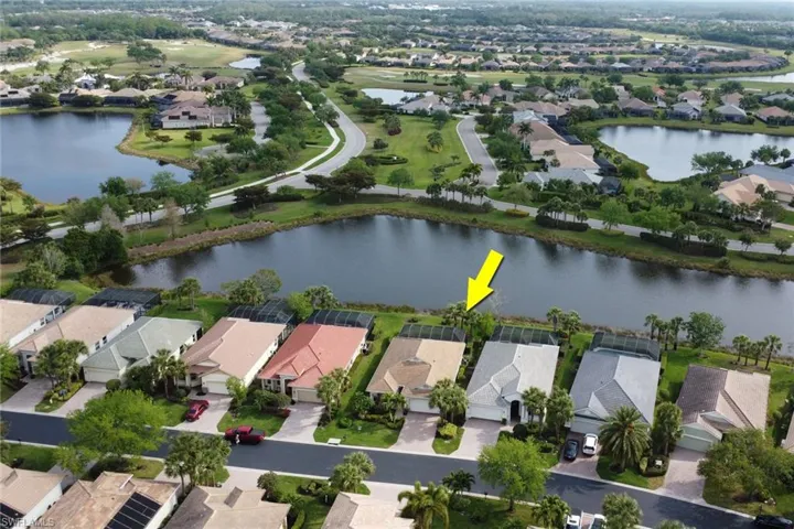 Aerial view of residential area with a large body of water