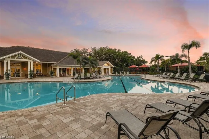 Community pool with a patio