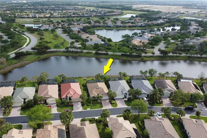 Aerial overview of property's location with nearby suburban area and a large body of water