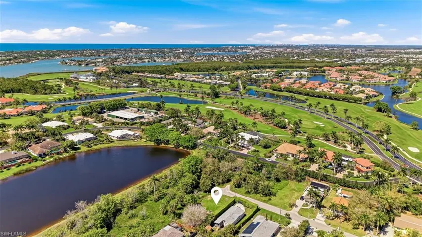 Aerial view of residential area featuring a golf club