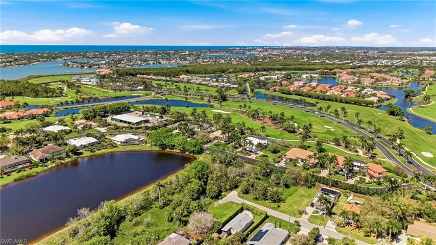 Aerial view of residential area featuring a golf club