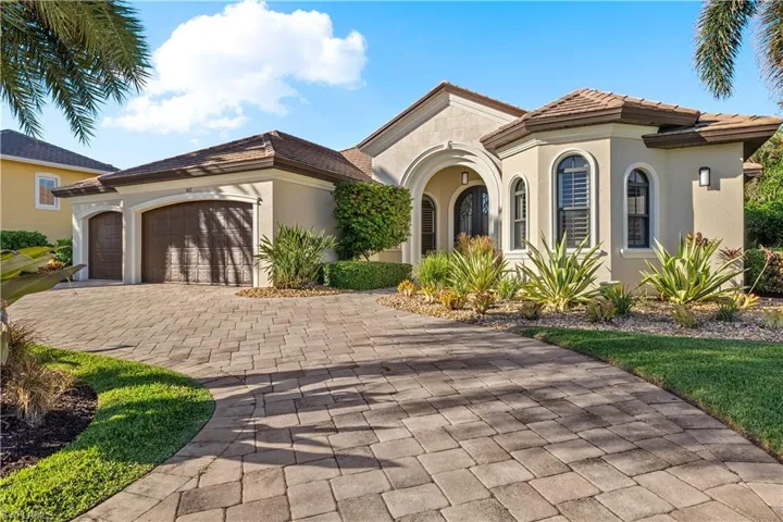 Mediterranean / spanish-style house with a garage
