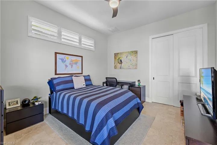 Bedroom with a closet and ceiling fan