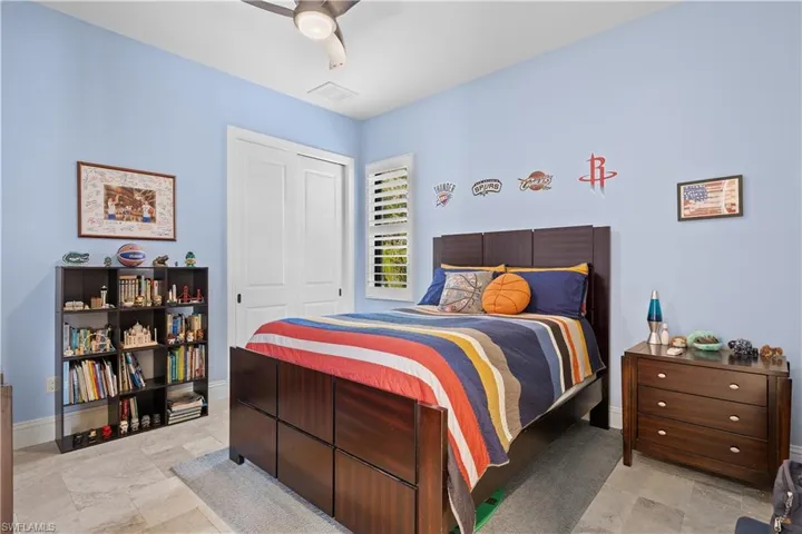Bedroom featuring a closet and ceiling fan