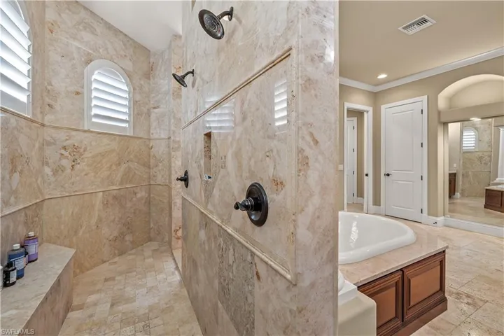 Bathroom with independent shower and bath and crown molding