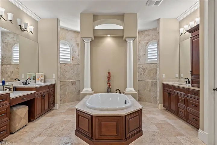 Bathroom with a wealth of natural light and tile walls