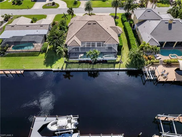 Birds eye view of property featuring a water view