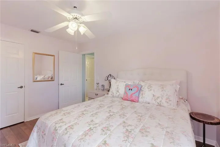 Bedroom featuring a ceiling fan and dark wood finished floors