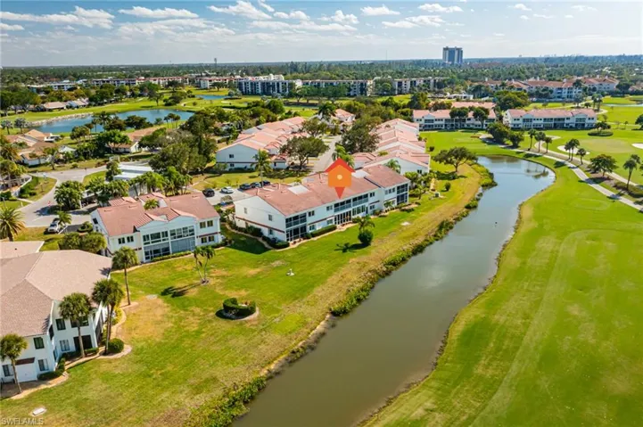 Bird's eye view of a golf club and a nearby body of water