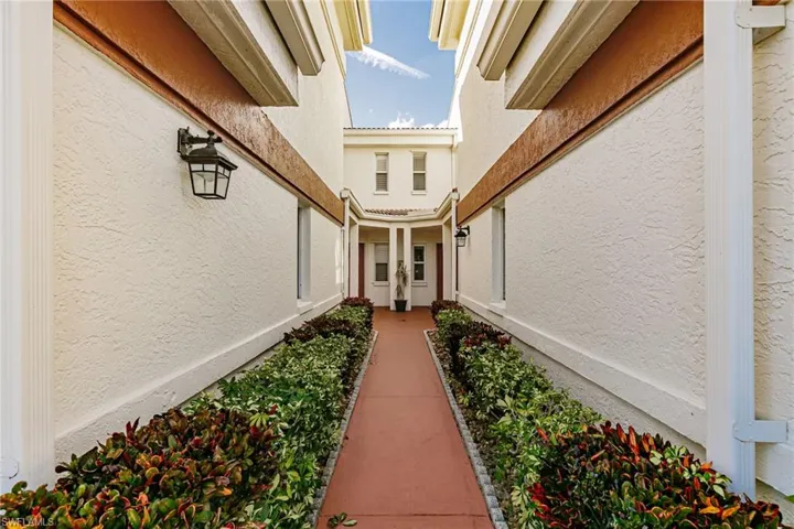 Entrance to property featuring stucco siding