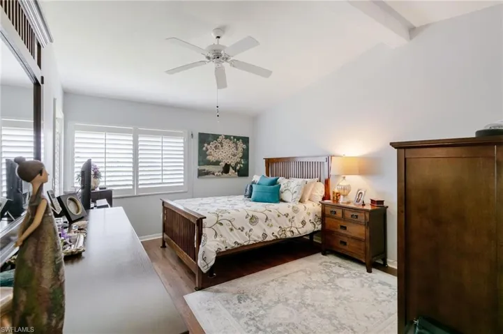 Master Bedroom with wood finished floors and a ceiling fan