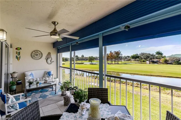 Lanai featuring outdoor lounge area, a water view, view of golf course, and ceiling fan