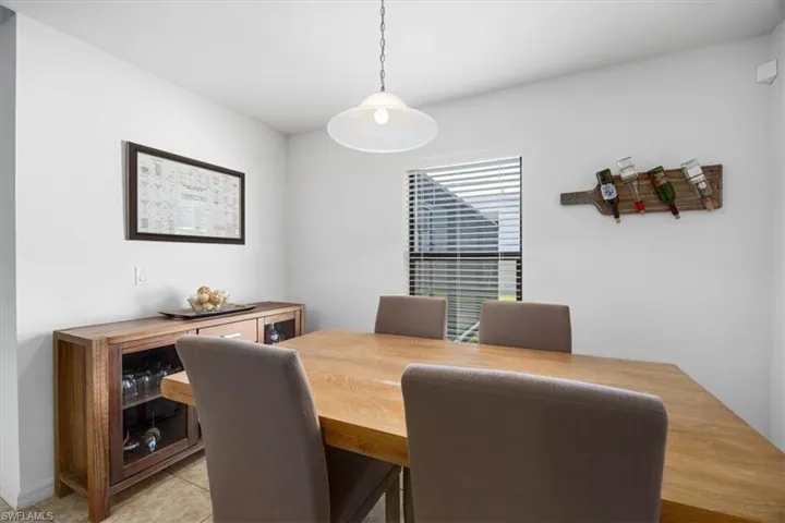 Dining area featuring light tile patterned floors