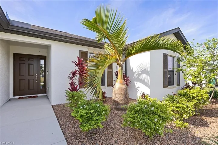 Property entrance with stucco siding