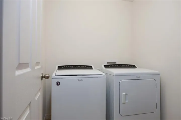 Laundry area with washing machine and clothes dryer