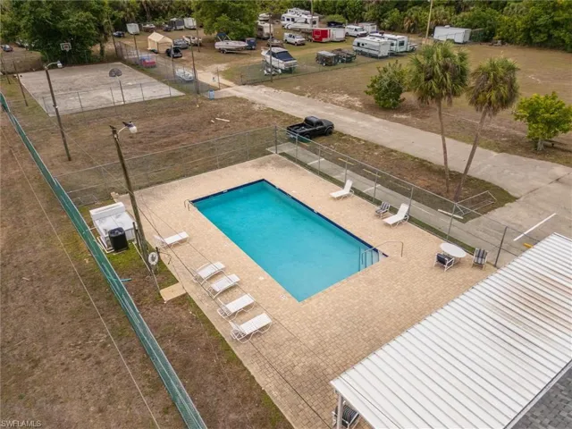 Community pool with a patio