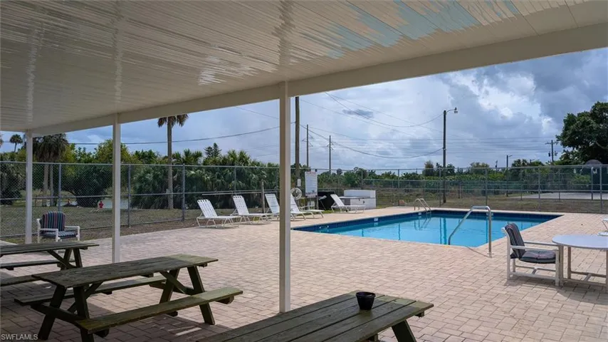 Community pool featuring a patio