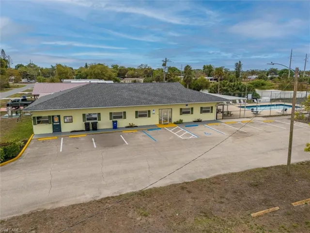 View of property with uncovered parking